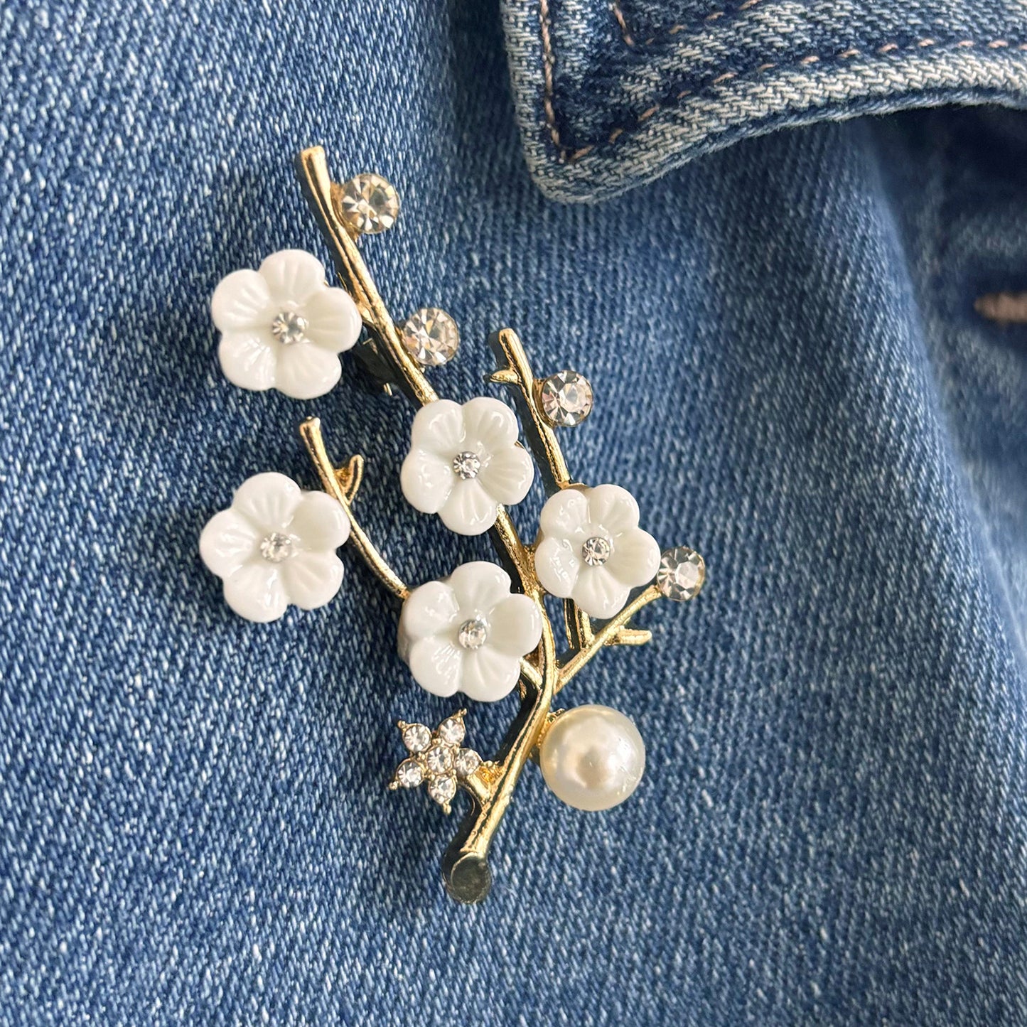 Sakura cherry blossom brooch with rhinestones and pearl on suede pouch