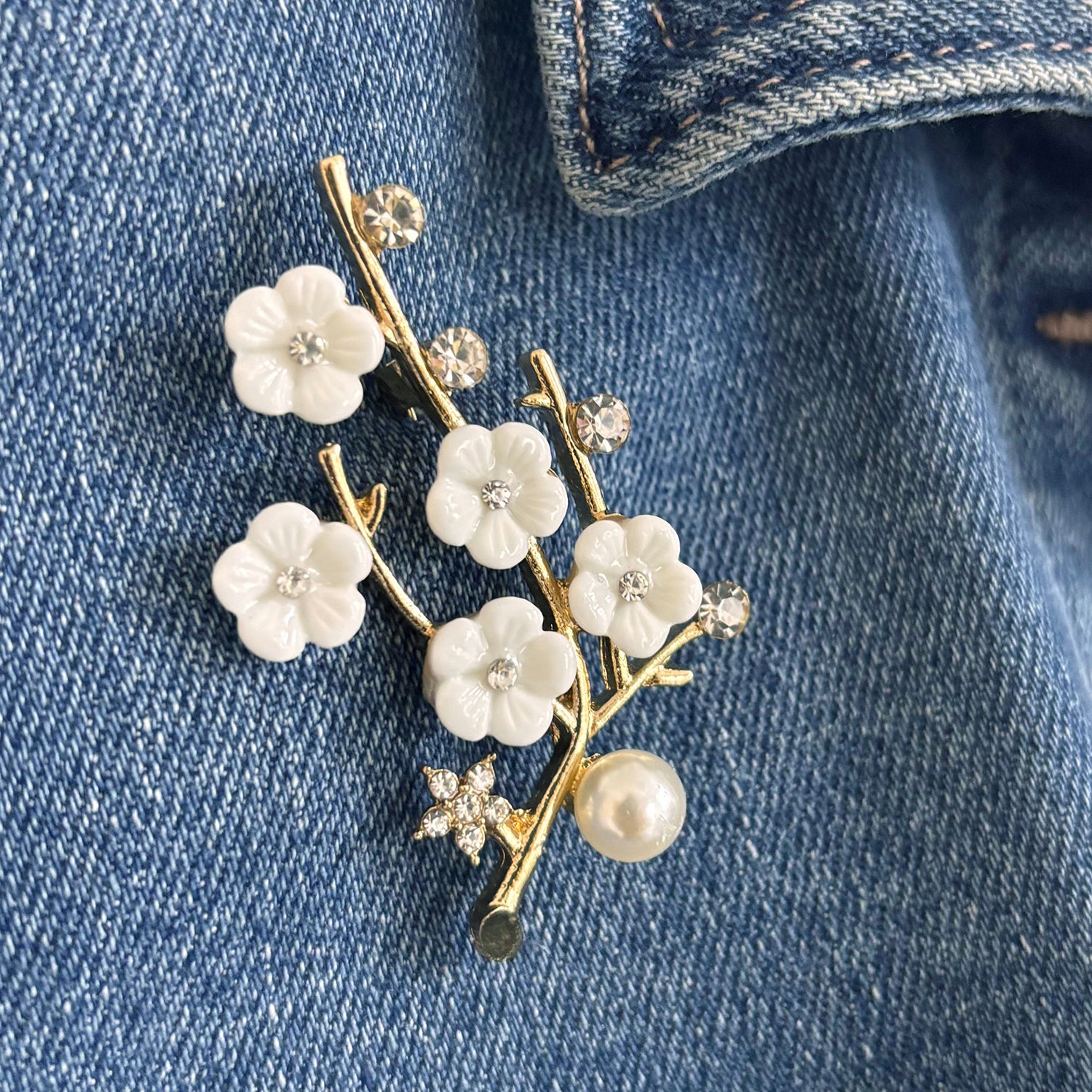 Sakura cherry blossom brooch with rhinestones and pearl on suede pouch