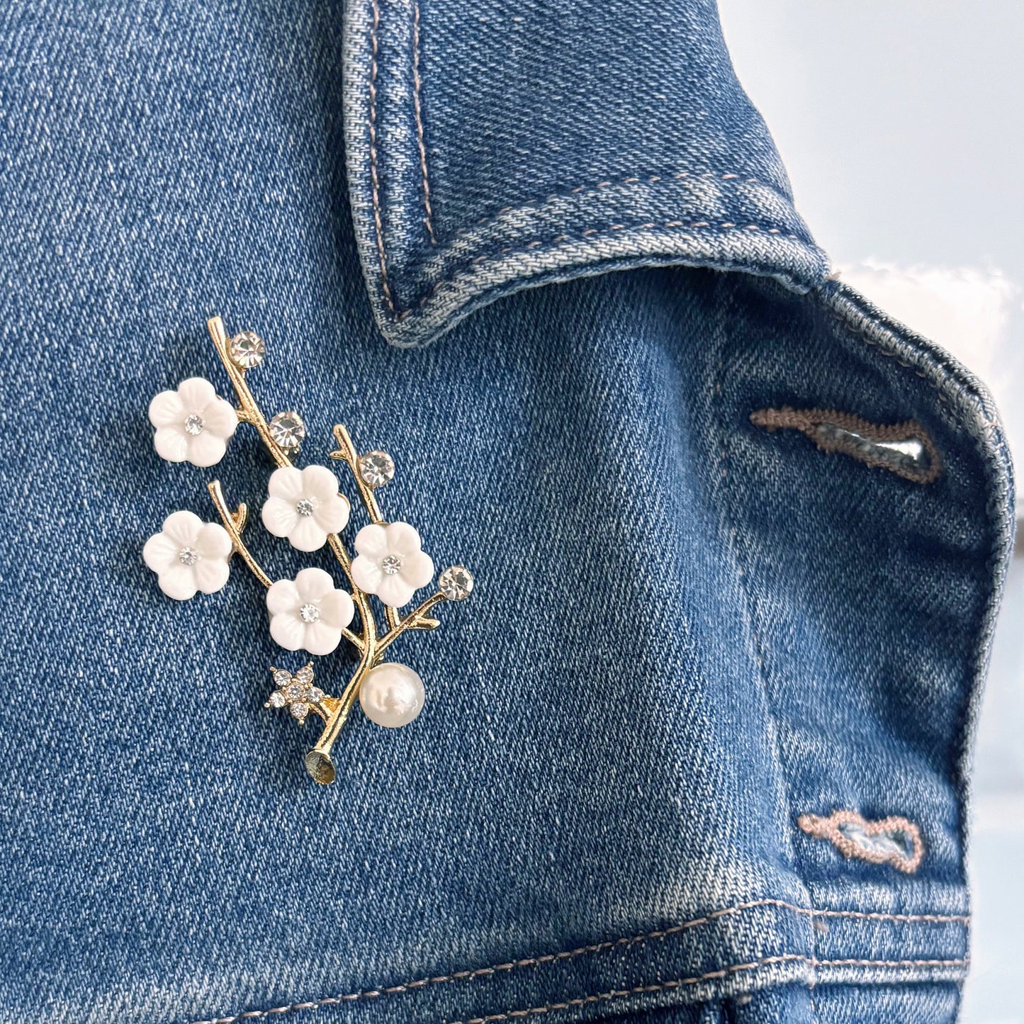 Sakura cherry blossom brooch with rhinestones and pearl on suede pouch