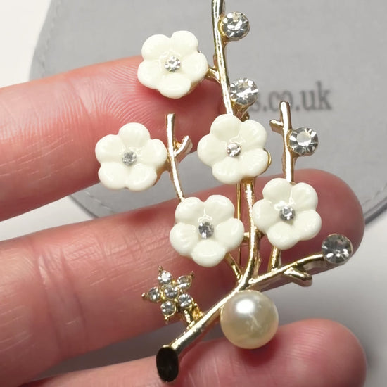 Sakura cherry blossom brooch with rhinestones and pearl on suede pouch